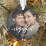 First Christmas engaged Photo Overlay Ornament<br><div class="desc">Celebrate your first Christmas together as an engaged couple with our "Our First Christmas Engaged" Custom Photo Names Ornament. This exquisite acrylic holiday ornament is a perfect keepsake to cherish the joyous memories of this special time in your lives. The ornament features an elegant script that spells out "engaged, "...</div>