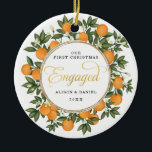 First Christmas Engaged Wedding Citrus Greenery Ceramic Tree Decoration<br><div class="desc">This citrus inspired Christmas ornament features beautiful hand-painted oranges and lush greenery. Great for a summer wedding!. The text fields are fully editable except for the word "Engaged". Simply remove this word by clicking the delete button and add your own text if you require a different word.</div>