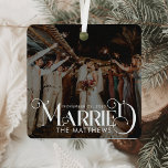 First Christmas Married Minimal Typography Photo Metal Tree Decoration<br><div class="desc">Celebrate your first holiday as a married couple with the First Christmas Married Minimal Typography Photo Metal Ornament. This ornament blends clean, minimalist design with handwritten script and a stylish vintage Christmas vibe, offering an elegant way to mark this special occasion. Made from shatterproof metal, it ensures durability while maintaining...</div>