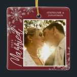 First Christmas Married Red Snowflakes Photo Ceramic Ornament<br><div class="desc">This square Christmas ornament is a perfect gift for the newly married couple. The design features a photo frame with handwritten text "Married" and is accented with light gray snowflakes on a dark red background. Personalize with a pictures of the couple,  their names and year.</div>
