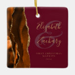 First Christmas Married Rust Agate Burgundy Gold Ceramic Ornament<br><div class="desc">This elegant modern ornament features a burnt orange and rust watercolor agate design trimmed with faux gold glitter. Easily customise the gold-coloured text on a burgundy background, with the names of the bride and groom in whimsical handwriting calligraphy over a large ampersand. The words "First Christmas Married" appear in serif...</div>