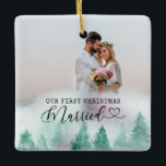 First Christmas Married Winter Forest 2 Photo Ceramic Ornament<br><div class="desc">Create your own double sided photo ornament with watercolor winter forest border. The wording reads "our first christmas married" in typewriter text and elegant calligraphy with a love heart. The photo template is set up for you to add 2 photos - one each side. You can also add your names...</div>
