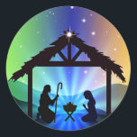 First Christmas Nativity Scene in Bethlehem Classic Round Sticker<br><div class="desc">This gorgeous sticker features the first Christmas scene in Bethlehem. Mary, Joseph, Baby Jesus and the stable are all in silhouette against a vibrant multi-colored sky dotted with stars in the background. Enjoy using these First Christmas Nativity Scene in Bethlehem Classic Round Sticker on your Christmas cards and gifts this...</div>