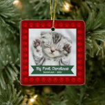 First Christmas Pet Kitten Photo Paws Red Custom Ceramic Ornament<br><div class="desc">“My First Christmas.” Celebrate your new pet’s arrival this past year! A red banner with your pet’s name and year in whimsical white typography overlays your kitten or puppy’s custom photo. A playful border of red paw prints against brick red surrounds it. Feel the warmth and joy of the holiday...</div>