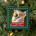 First Christmas Pet Puppy Photo Paws Green Custom Ceramic Ornament<br><div class="desc">“My First Christmas.” Celebrate your new pet’s arrival this past year! A red banner with your pet’s name and year in whimsical white typography overlays your puppy or kitten’s custom photo. A playful border of dusty green paw prints against dark green surrounds it. Feel the warmth and joy of the...</div>