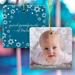 First Hanukkah Baby Stars Snowflakes Grandparents Ceramic Ornament<br><div class="desc">“First Hanukkah.” A playful visual of white Stars of David, snowflakes and handwritten script typography with customised year, overlaying the photo of your choice, help you usher in Hanukkah and New Year. On the back, additional white Stars of David, snowflakes and handwritten typography with “proud grandparents of baby’s name” overlay...</div>