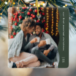 First married Christmas two photo simple green Ceramic Ornament<br><div class="desc">This simple modern Christmas ornament features a trendy wavy green edge along with a large photo and room for custom text and the year. Designed for a newlywed ornament celebrating a first Christmas together, this ornament features one large photo on the front and a second on the back with two...</div>
