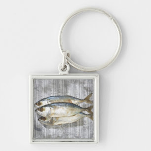 Fish on financial newspaper, elevated view key ring