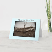 fishing boat with lobster pots on beach at seaside