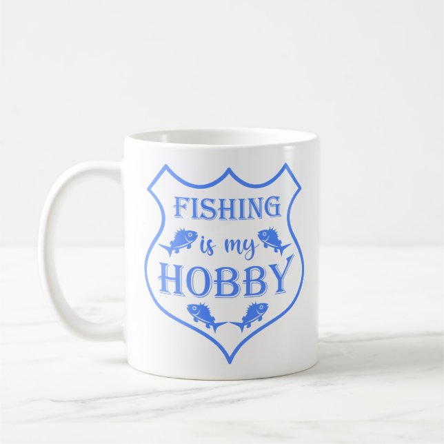 Fishing is my hobby shield quote on crest coffee mug (Left)