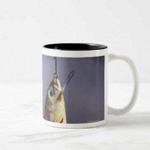 fishing lure in front of water Two-Tone coffee mug