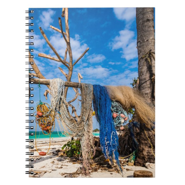 Fishing nets drying on the beach notebook (Front)