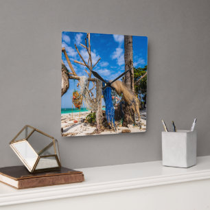 Fishing nets drying on the beach square wall clock