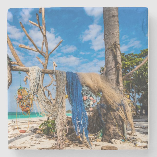 Fishing nets drying on the beach stone coaster (Front)