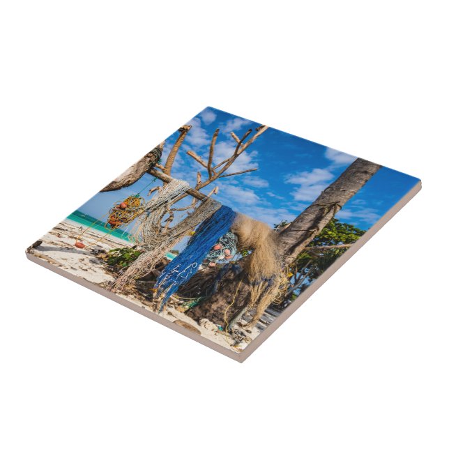 Fishing nets drying on the beach tile (Side)