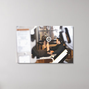 fitness coach works with 'senior' in gym canvas print