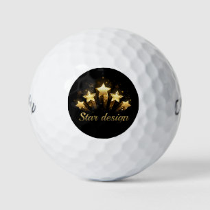 Five gold stars on black golf balls