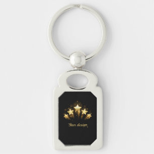 Five gold stars on black key ring