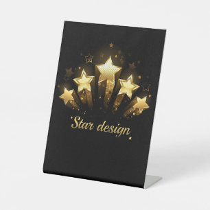 Five gold stars on black pedestal sign