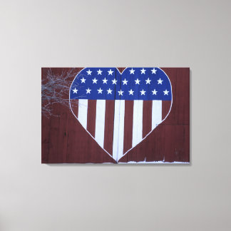 Flag in heart shape painted on barn after 9-11. canvas print