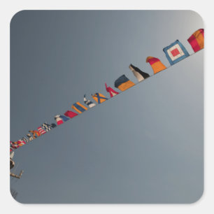 Flags fly over the deck of the USS Iwo Jima Square Sticker