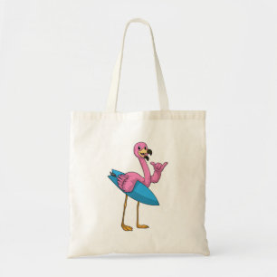 Flamingo as Surfer with Surfboard Tote Bag