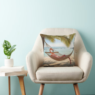 Flamingo Lounging in a Tropical Beach Hammock Cushion
