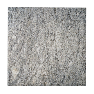 Flat surface of a grey granite stone tile