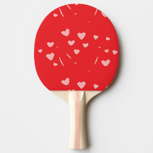 floating hearts on red ping pong paddle