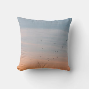 FLOCK OF BIRD AT THE BLUE AND ORANGE SKIES CUSHION