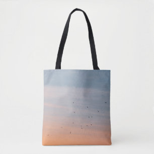 FLOCK OF BIRD AT THE BLUE AND ORANGE SKIES TOTE BAG