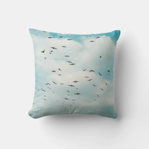 Flock of grey dove fly on vintage blue sky. above, cushion