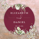 Floral Greenery Burgundy Wedding Favor Classic Round Sticker<br><div class="desc">Elegant burgundy floral greenery sticker personalized with your names and special date. Designed by Thisisnotme©</div>