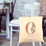 Floral Letter Initial O Watercolor Pink Bouquet Tote Bag<br><div class="desc">Personalised tote bag with your monogram - name and inital. The floral letter O is designed in rose pink glitter and decorated with a pink and ivory bouquet of watercolor flowers and greenery. The template is set up for you to add your name in dusty pink hand lettered script. A...</div>