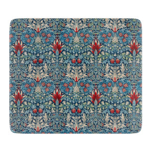 Floral pattern on green leaves blue background cutting board