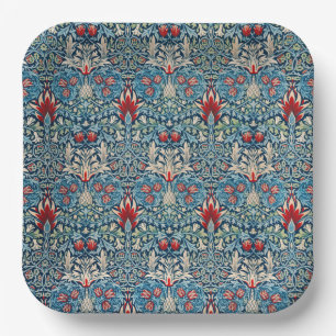 Floral pattern on green leaves blue background paper plate
