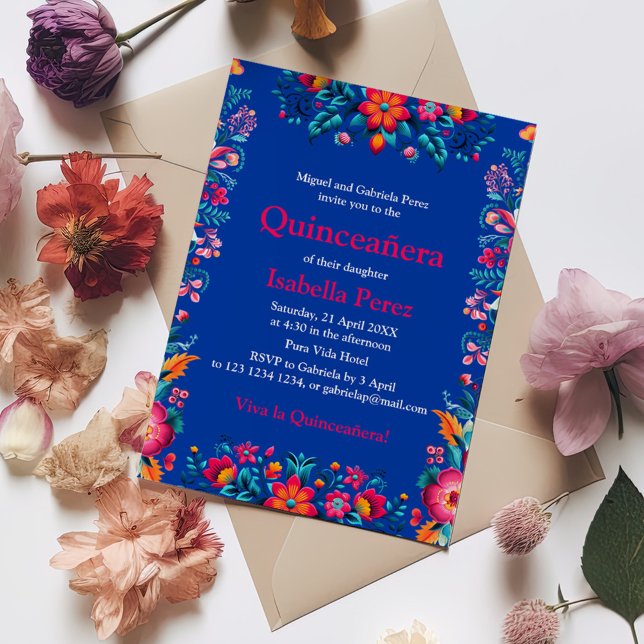Floral Quinceanera Blue Mexican Fiesta Birthday Invitation (Floral Quinceanera Blue Mexican Fiesta Birthday Invitation on a table with colorful flowers.)