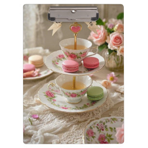 Floral table, teacups, tiered trays macarons queen clipboard