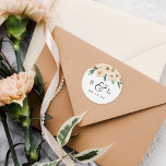 Floral Wedding Date & Couples Initials  Classic Round Sticker<br><div class="desc">A classic design theme with your initials separated by an ampersand with beautiful flourishes. Your wedding date appears below in italic serif numbers. At the top of these stickers, there is a hand-painted bouquet of blush pink flowers and lush greenery against a shower of faux gold glitter. View the collection...</div>