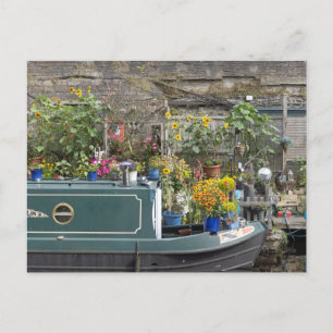 Flower garden and narrow boat postcard
