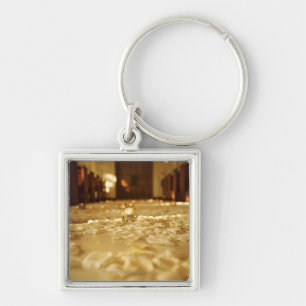 Flower petals on floor of church key ring