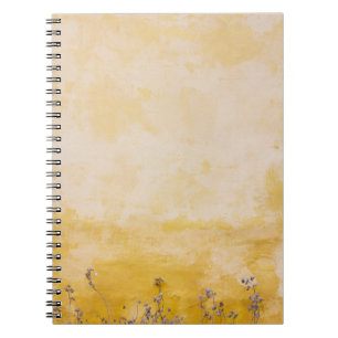 Flowers beside yellow wall notebook