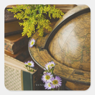 Flowers with antique globe and books square sticker
