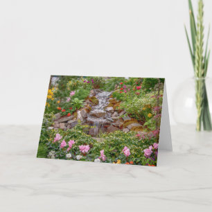 Flowing Waterfall with spring flowers Card