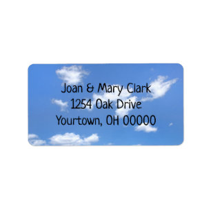 fluffy clouds in summer sky label