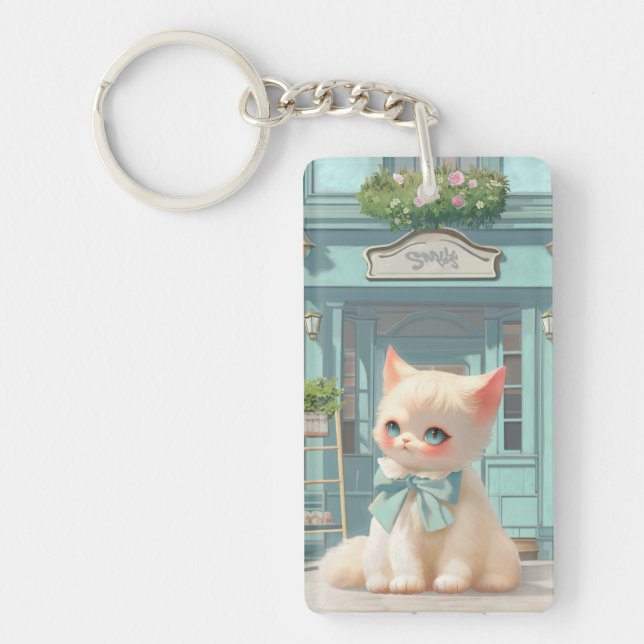 Fluffy Kitten with Blue Bow at Pastry Shop Key Ring (Front)