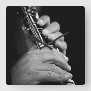 Flute being played in black and white by gypsy square wall clock