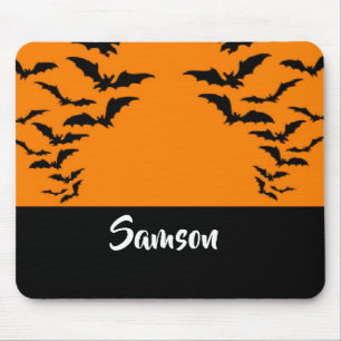 Flying bats on orange mouse mat
