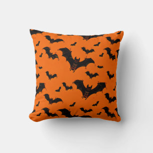 Flying Cartoon Bats on an Orange Background Cushion