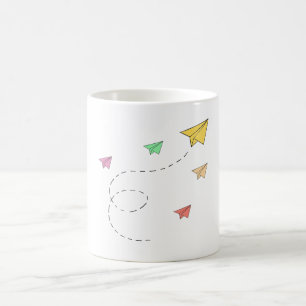 Flying paper planes coffee mug